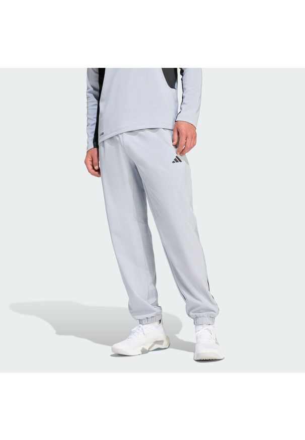 Adidas - Spodnie Dresowe Tech Essentials Workout. Kolor: szary. Materiał: dresówka. Technologia: ClimaCool (Adidas). Sport: fitness