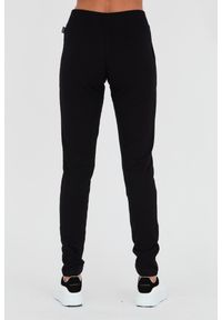 MOSCHINO Czarne spodnie dresowe. Kolor: czarny. Materiał: dresówka #2