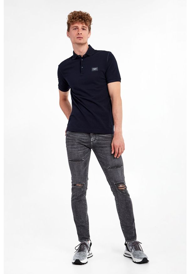 Dolce & Gabbana - Polo DOLCE & GABBANA. Typ kołnierza: polo. Materiał: skóra, bawełna. Wzór: aplikacja. Styl: klasyczny