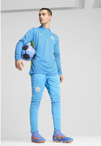 Puma - Męska bluza treningowa Manchester City z zamkiem 1/4 PUMA Magic Blue Yellow Glow. Kolor: niebieski, żółty, wielokolorowy. Sport: piłka nożna