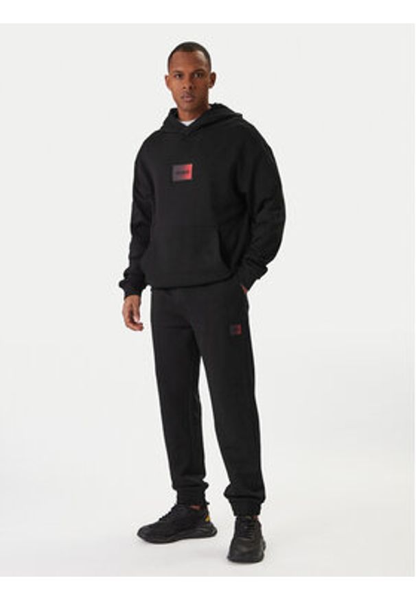 Hugo - HUGO Spodnie dresowe Danopan 50553146 Czarny Relaxed Fit. Kolor: czarny. Materiał: bawełna