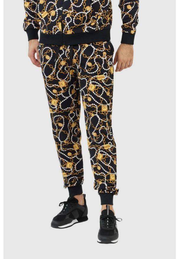 MOSCHINO Męskie spodnie dresowe w złote łańcuchy, Rozmiar L. Kolor: czarny. Materiał: dresówka