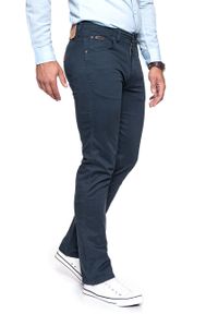 Wrangler - WRANGLER SPODNIE MĘSKIE ARIZONA STRETCH NAVY W12OP849I. Materiał: materiał. Wzór: jednolity. Styl: klasyczny