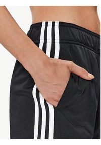 Adidas - adidas Spodnie dresowe Essentials Warm-Up 3-Stripes H48451 Czarny Regular Fit. Kolor: czarny. Materiał: syntetyk #2