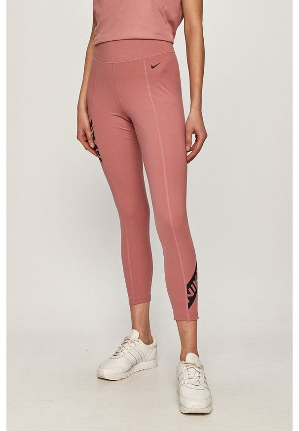 Nike - Legginsy. Kolor: różowy. Materiał: tkanina, dzianina, skóra, włókno. Technologia: Dri-Fit (Nike). Wzór: nadruk