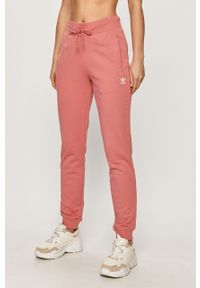 adidas Originals - Spodnie. Kolor: różowy. Materiał: bawełna, materiał, dzianina, elastan, poliester. Wzór: gładki #1