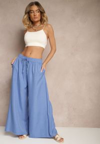 Renee - Niebieskie Szerokie Spodnie High Waist Ozdobione Wiązaniem Telonia. Okazja: na co dzień. Stan: podwyższony. Kolor: niebieski. Wzór: aplikacja. Styl: casual, elegancki