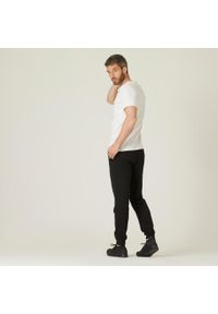 DOMYOS - Spodnie dresowe męskie Nyamba Gym & Pilates 120. Kolor: czarny. Materiał: bawełna, materiał, poliester. Wzór: ze splotem. Sport: joga i pilates