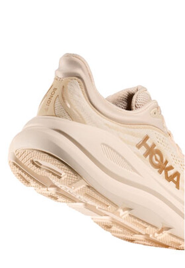 HOKA - Hoka Buty do biegania Bondi 9 1162012 Beżowy. Kolor: beżowy. Materiał: materiał