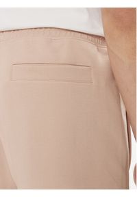 Hugo Spodnie dresowe Dimacs 50509457 Beżowy Relaxed Fit. Kolor: beżowy. Materiał: bawełna