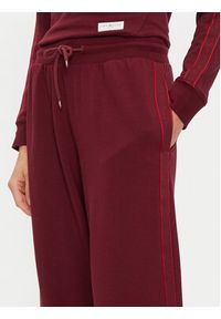 TOMMY HILFIGER - Tommy Hilfiger Spodnie dresowe UW0UW04771 Bordowy Relaxed Fit. Kolor: czerwony. Materiał: dresówka