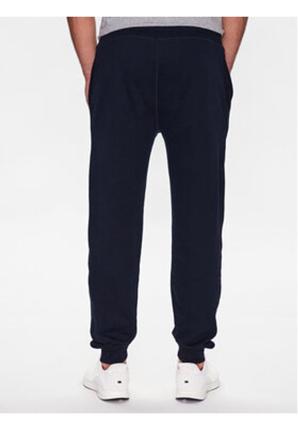 TOMMY HILFIGER - Tommy Hilfiger Spodnie dresowe UM0UM02880 Granatowy Regular Fit. Kolor: niebieski. Materiał: syntetyk, bawełna