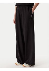 Tommy Jeans Spodnie dresowe DW0DW22951 Czarny Relaxed Fit. Kolor: czarny. Materiał: bawełna #1