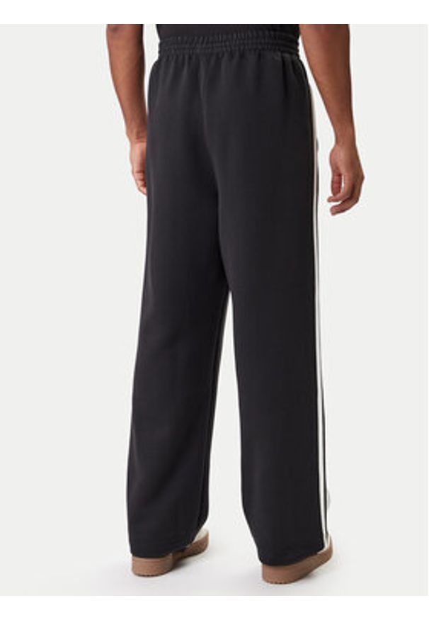 Adidas - adidas Spodnie dresowe adicolor Spacer Track JX1506 Czarny Baggy Fit. Kolor: czarny. Materiał: bawełna. Sport: turystyka piesza