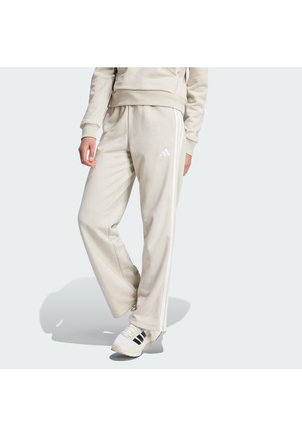 Adidas - Spodnie Essentials 3-Stripes Open Hem French Terry. Kolor: biały, wielokolorowy, beżowy. Materiał: materiał. Sport: fitness