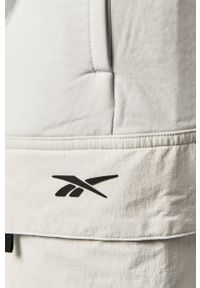 Reebok - Spodnie. Kolor: biały. Materiał: wiskoza, dzianina, elastan, nylon, poliester. Wzór: gładki #4