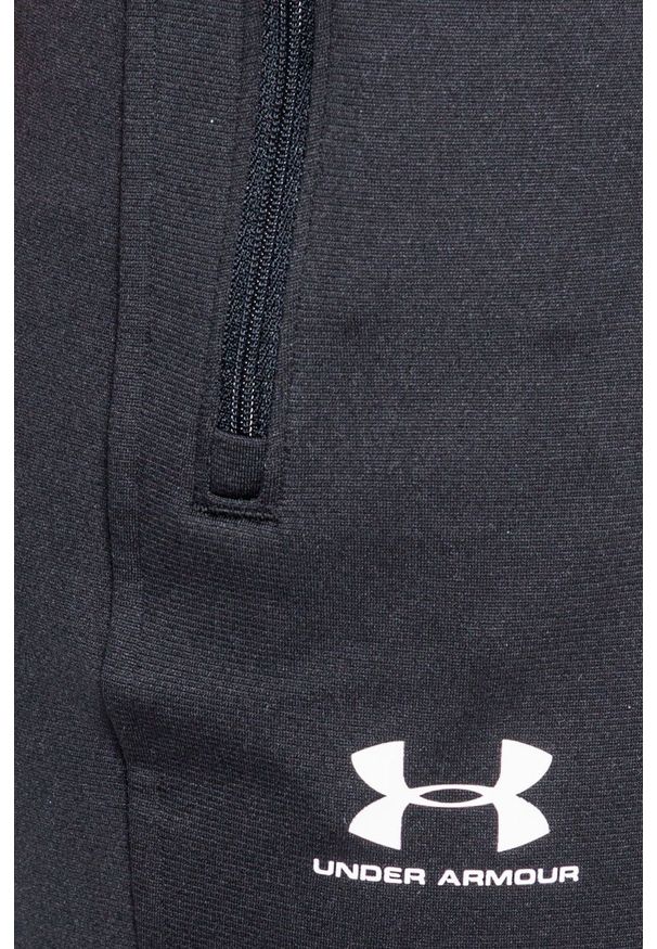 Under Armour - Spodnie Sportstle. Kolor: czarny. Materiał: dzianina. Wzór: gładki