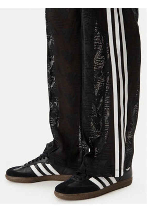 Adidas - adidas Spodnie dzianinowe Crochet Firebird KD0346 Czarny Regular Fit. Kolor: czarny. Materiał: syntetyk