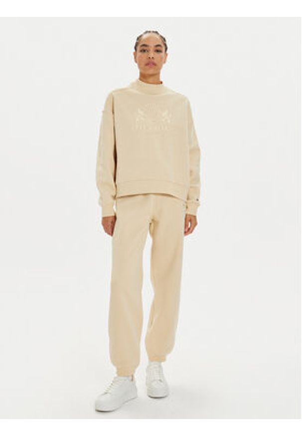 TOMMY HILFIGER - Tommy Hilfiger Spodnie dresowe Varsity WW0WW42884 Beżowy Regular Fit. Kolor: beżowy. Materiał: bawełna, syntetyk