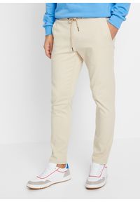 bonprix - Spodnie chino z gumką w talii, w krótszej długości, Regular Fit Tapered. Kolor: beżowy. Długość: krótkie