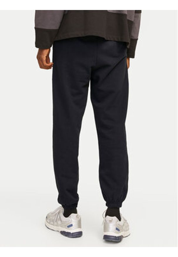 Jack & Jones Spodnie dresowe Morgan 12257964 Czarny Regular Fit. Kolor: czarny. Materiał: bawełna, syntetyk