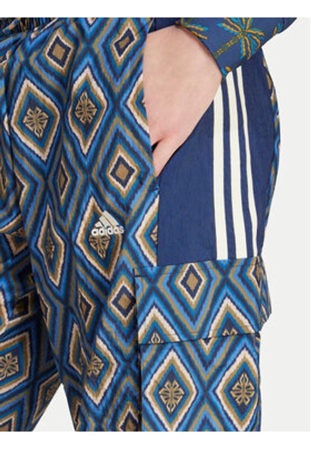 Adidas - adidas Spodnie dresowe FARM Rio Premium IV9760 Granatowy Loose Fit. Kolor: niebieski. Materiał: syntetyk