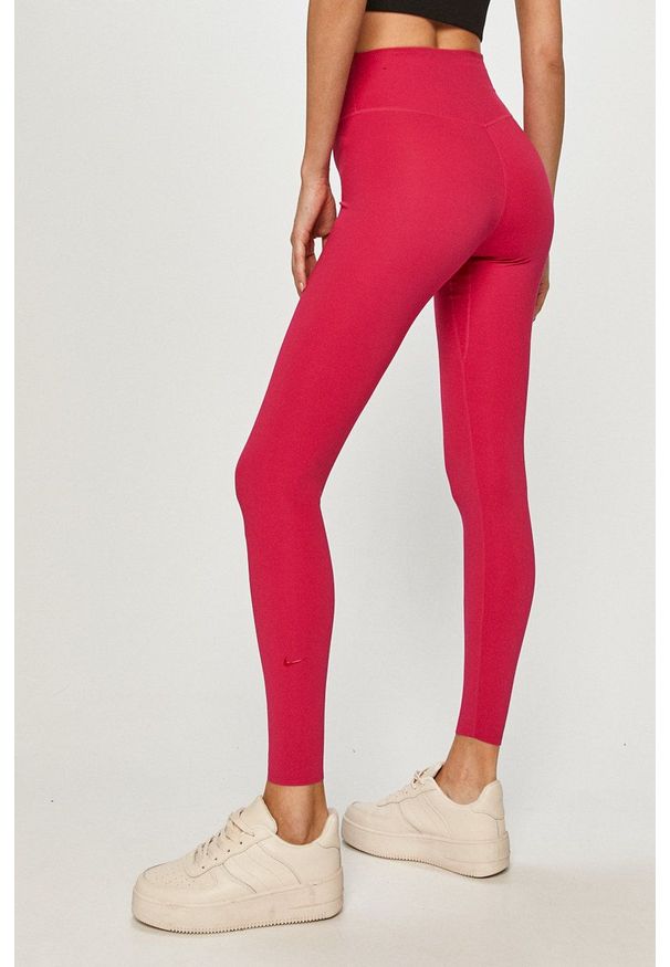 Nike - Legginsy. Kolor: różowy. Materiał: tkanina, dzianina, skóra, włókno. Technologia: Dri-Fit (Nike)
