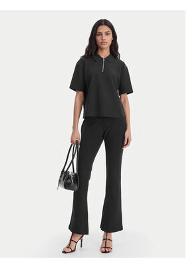 Calvin Klein Spodnie materiałowe LV044B223G Czarny Flare Fit. Kolor: czarny. Materiał: syntetyk