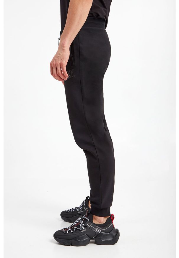 EA7 Emporio Armani - Spodnie dresowe EA7 EMPORIO ARMANI. Materiał: dresówka. Wzór: nadruk