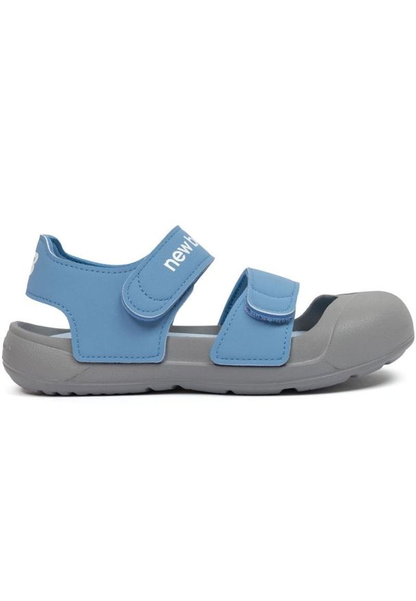 Sandały New Balance Jr SYA809R3 niebieskie. Zapięcie: rzepy. Kolor: niebieski. Materiał: materiał. Wzór: paski. Styl: młodzieżowy, sportowy