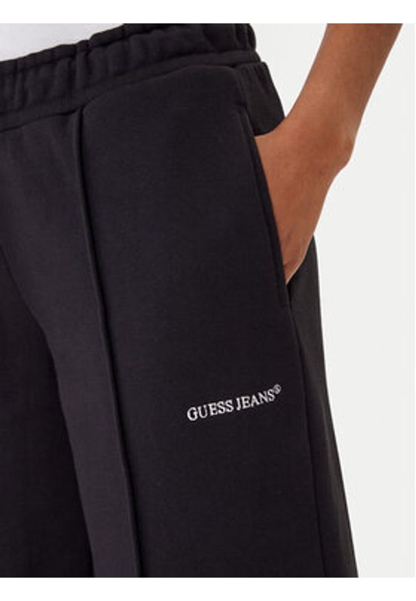 Guess Jeans Spodnie dresowe W5BB04 KC811 Czarny Wide Leg. Kolor: czarny. Materiał: bawełna