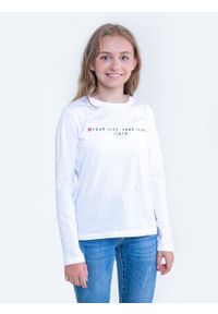 Big-Star - Bluzka dziewczęca longsleeve biała Brina 101. Okazja: na co dzień, na uczelnię. Kolor: biały. Materiał: jeans, bawełna. Długość rękawa: długi rękaw. Długość: długie. Wzór: nadruk, aplikacja. Styl: młodzieżowy, casual #1