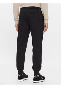 Calvin Klein Jeans Spodnie dresowe Monologo J30J324685 Czarny Regular Fit. Kolor: czarny. Materiał: bawełna, syntetyk