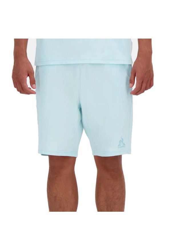 Spodnie Le Coq Sportif Model 2510635l Kolor Niebieski. Kolor: niebieski. Materiał: tkanina. Długość: krótkie. Sezon: lato