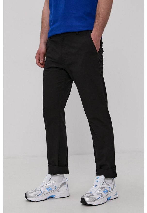 Tommy Jeans Spodnie DM0DM10119.4891 męskie kolor czarny proste. Okazja: na co dzień. Kolor: czarny. Materiał: tkanina. Styl: casual