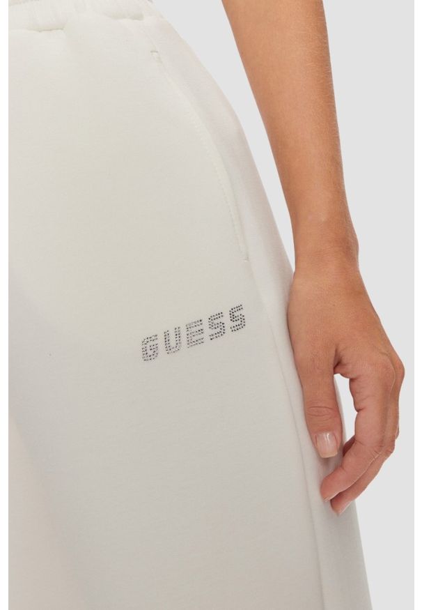 Guess - GUESS Dresowe damskie spodnie w kolorze ecru Cecilia Scuba, Rozmiar M. Kolor: beżowy. Materiał: dresówka