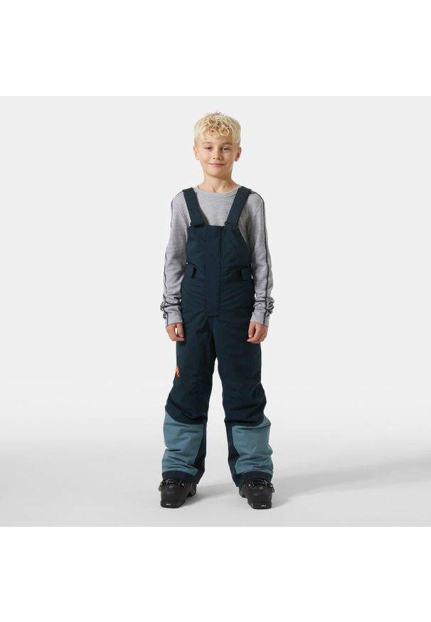 Dziecięcy kombinezon narciarski Helly Hansen Summit 2.0. Kolor: niebieski. Sezon: zima. Sport: narciarstwo