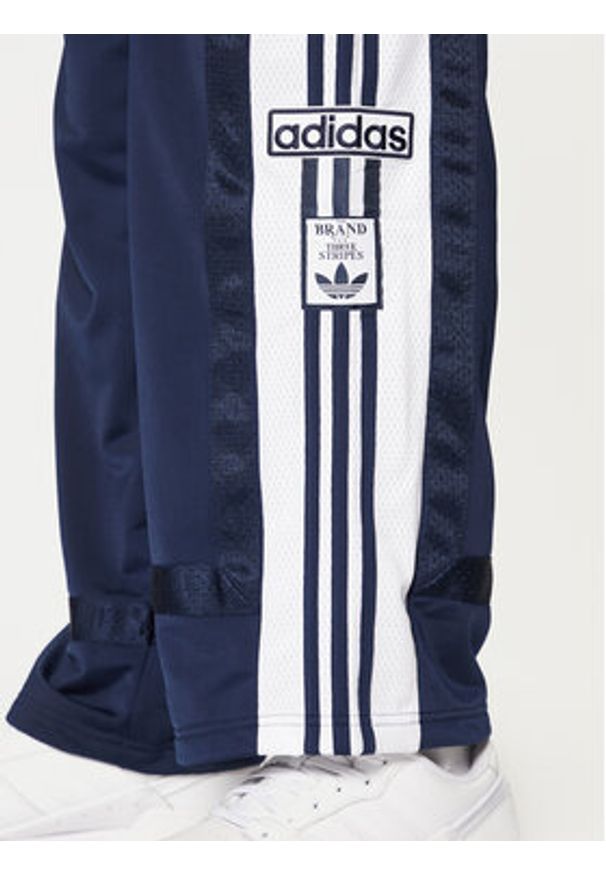 Adidas - adidas Spodnie dresowe Adibreak JD4268 Granatowy Loose Fit. Kolor: niebieski. Materiał: syntetyk