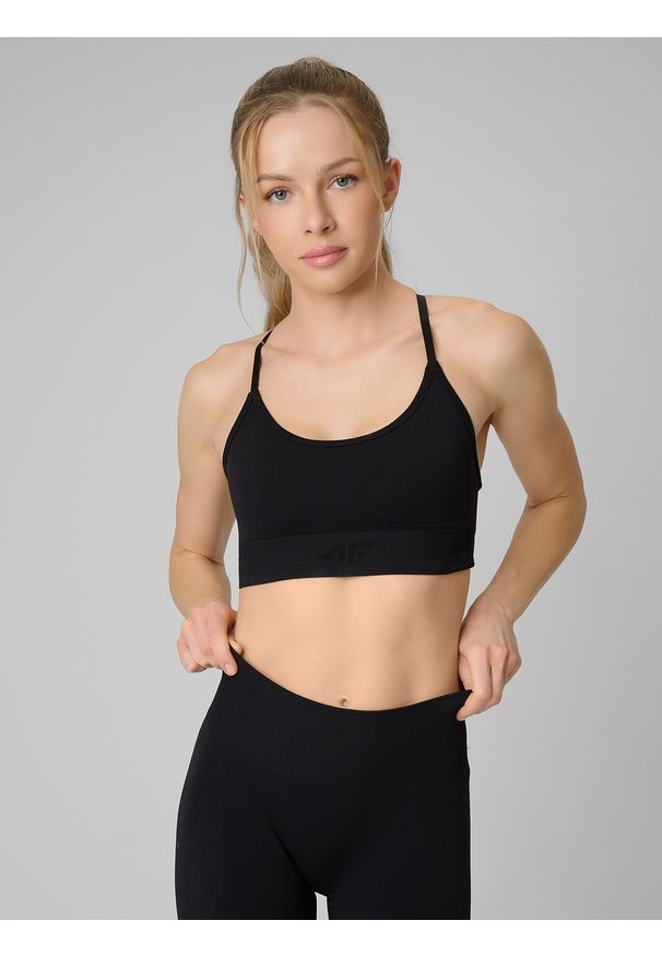 4f - 4F Biustonosz treningowy bezszwowy z niskim wsparciem damski - czarny M/L. Kolor: czarny. Materiał: skóra. Rodzaj stanika: wyciągane miseczki. Sport: fitness, joga i pilates