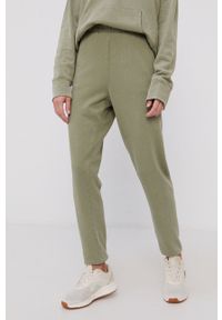DKNY - Dkny Spodnie damskie kolor zielony gładkie. Kolor: zielony. Materiał: dzianina. Wzór: gładki