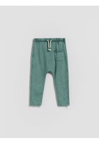 Reserved - Legginsy z efektem sprania - ciemnozielony. Kolor: zielony. Materiał: bawełna, dzianina
