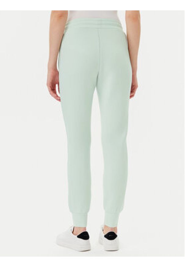 Guess Spodnie dresowe V2YB18 K7UW2 Zielony Regular Fit. Kolor: zielony. Materiał: wiskoza