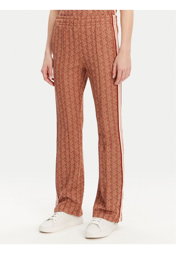 Lacoste Spodnie dresowe XF9313 Pomarańczowy Regular Fit. Kolor: pomarańczowy. Materiał: bawełna, syntetyk