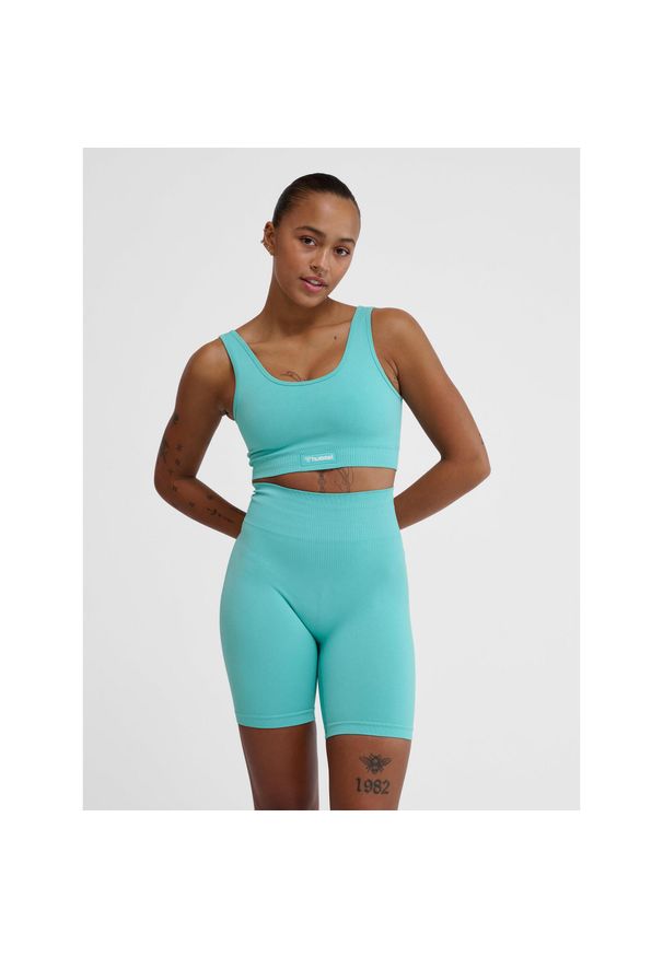 Bezszwowy biustonosz dla kobiet Hummel Alive. Typ kołnierza: polo. Kolor: wielokolorowy, niebieski, zielony. Sport: fitness