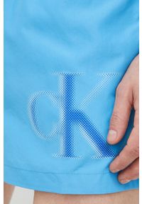 Calvin Klein szorty kąpielowe kolor niebieski. Kolor: niebieski. Materiał: tkanina, poliester, materiał. Wzór: nadruk #4
