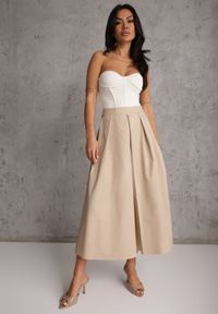 Renee - Beżowa Bawełniana Spódnica o Rozkloszowanym Kroju z Plisami Nerimara. Okazja: na co dzień. Kolor: beżowy. Materiał: bawełna. Wzór: aplikacja. Sezon: lato. Styl: casual #1