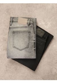 Reserved - Jeansy bootcut z efektem sprania - czarny. Kolor: czarny