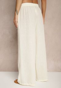 Renee - Jasnobeżowe Spodnie Palazzo o Szerokim Kroju High Waist Ollevia. Okazja: na co dzień, na spotkanie biznesowe. Stan: podwyższony. Kolor: beżowy. Materiał: jedwab. Wzór: aplikacja. Styl: biznesowy, elegancki, casual