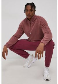 adidas Originals Spodnie męskie kolor fioletowy gładkie. Kolor: fioletowy. Materiał: poliester, bawełna. Wzór: gładki