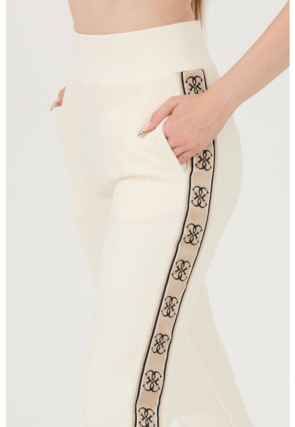 Guess - GUESS Beżowe damskie spodnie dresowe Britney Jogger, Rozmiar XL. Kolor: beżowy. Materiał: dresówka